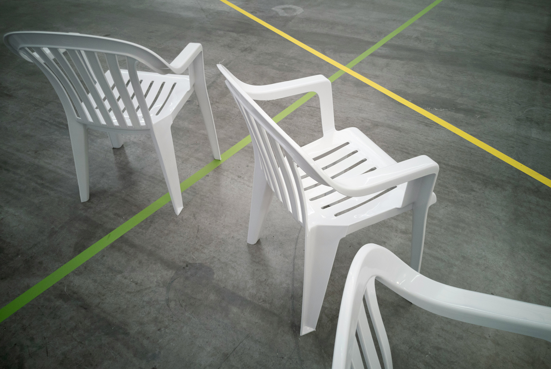 White plastic chairs. Photo. 