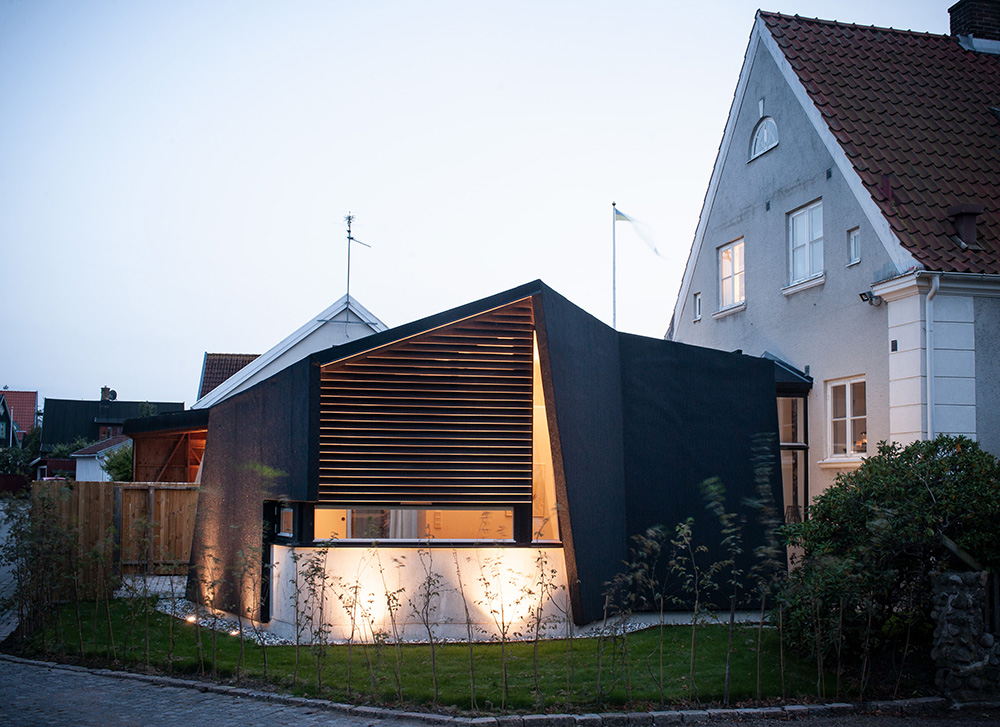 Older house with modern extension. Photo. 